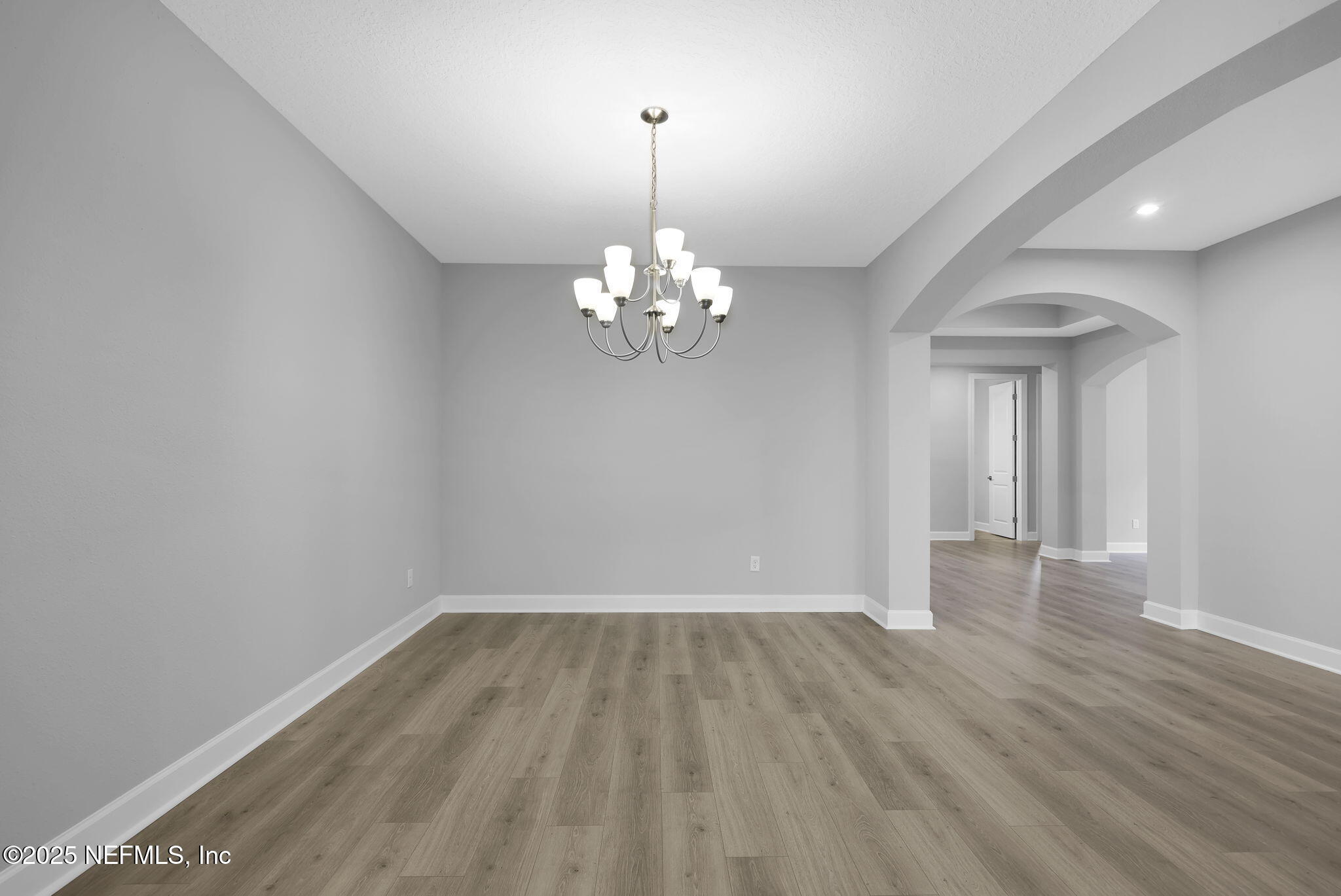 39 Greylock Lane St. Augustine, FL 32092 - Photo 20 of 54 a view of a room with wooden floor and chandelier