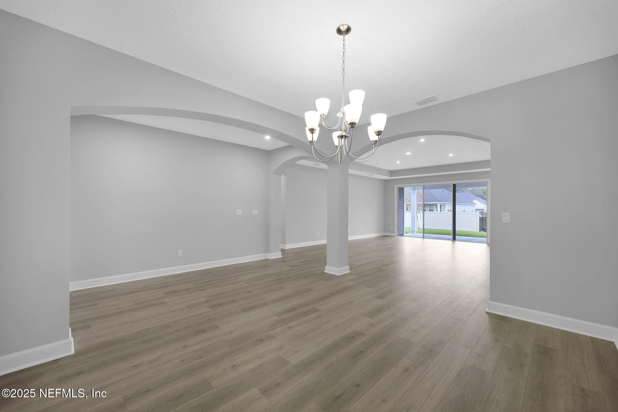 39 Greylock Lane St. Augustine, FL 32092 - Photo 21 of 54 a view of a livingroom with a chandelier wooden floor and chandelier