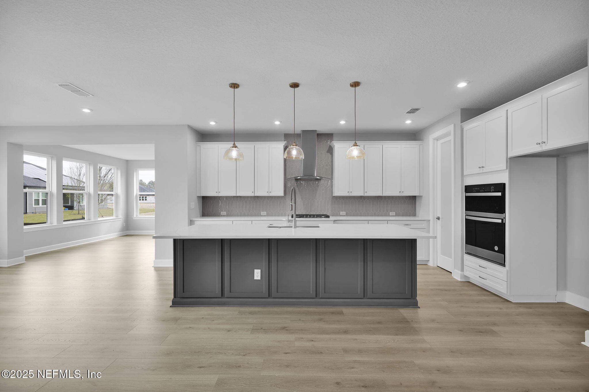 39 Greylock Lane St. Augustine, FL 32092 - Photo 23 of 54 a large kitchen with cabinets and wooden floor