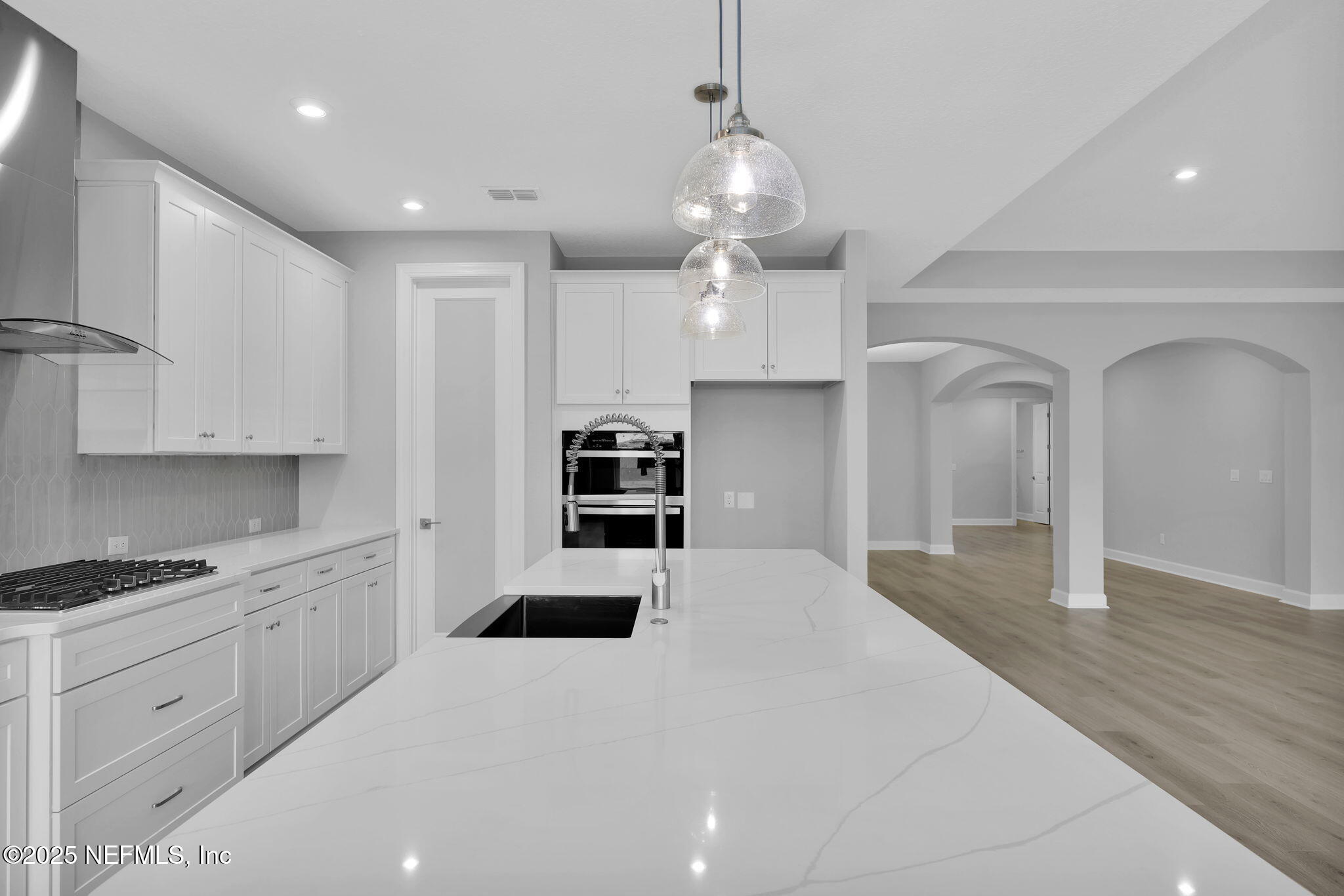 39 Greylock Lane St. Augustine, FL 32092 - Photo 26 of 54 a large white kitchen with kitchen island a sink stainless steel appliances and cabinets