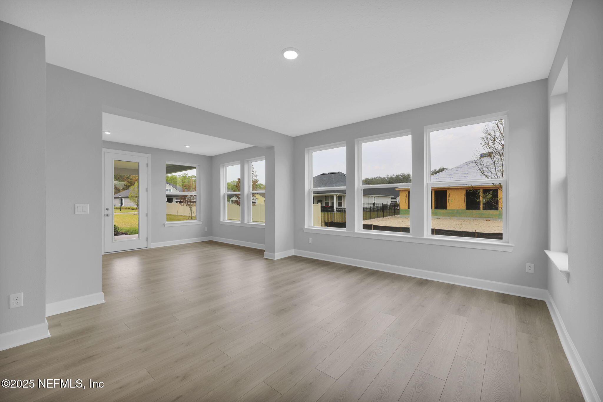 39 Greylock Lane St. Augustine, FL 32092 - Photo 29 of 54 a view of an empty room with a window and wooden floor