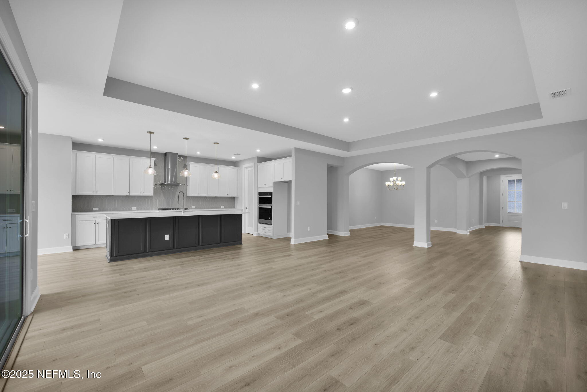 39 Greylock Lane St. Augustine, FL 32092 - Photo 34 of 54 a view of kitchen with kitchen island wooden floor center island and stainless steel appliances