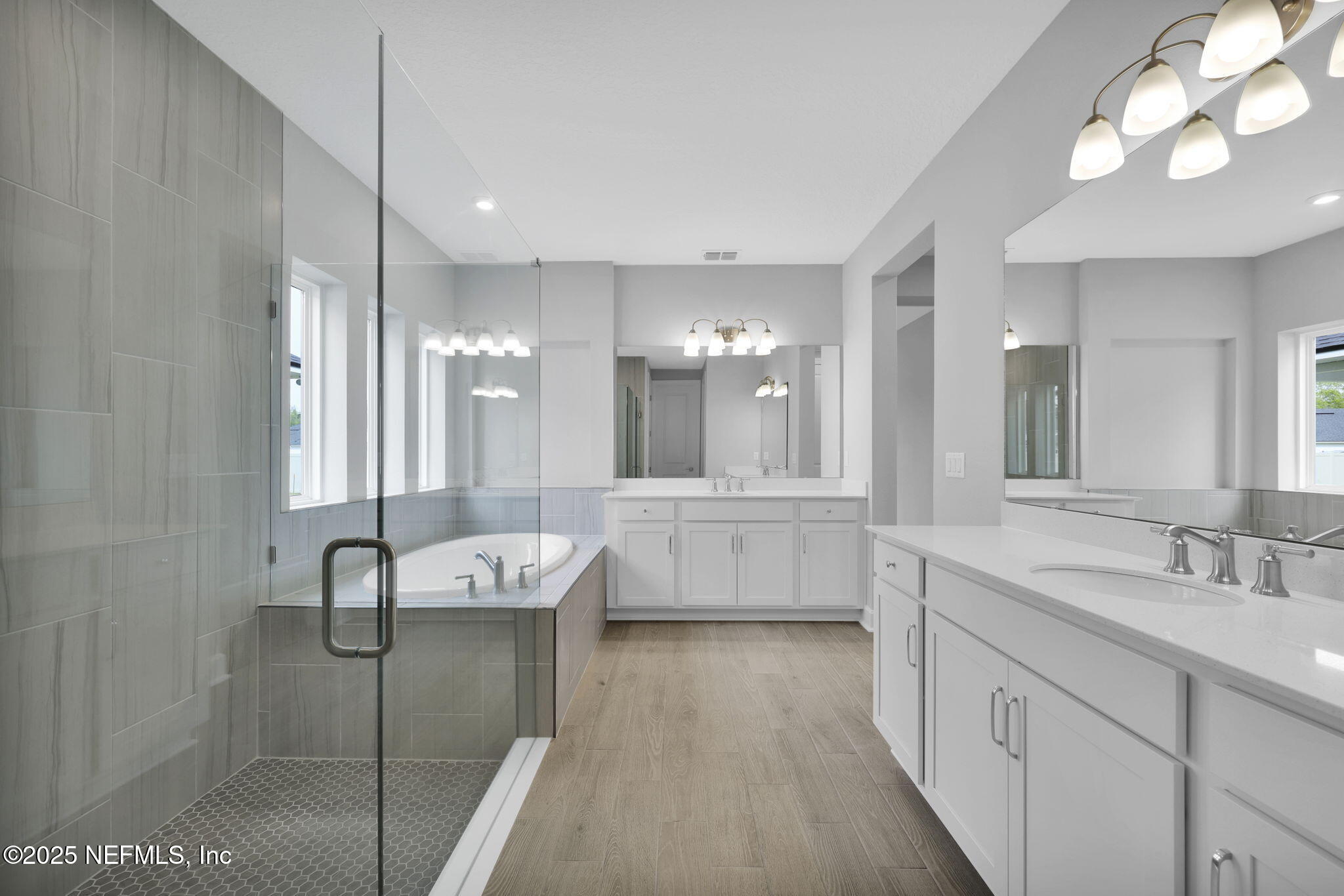 39 Greylock Lane St. Augustine, FL 32092 - Photo 40 of 54 a bathroom with a granite countertop sink a large mirror and shower