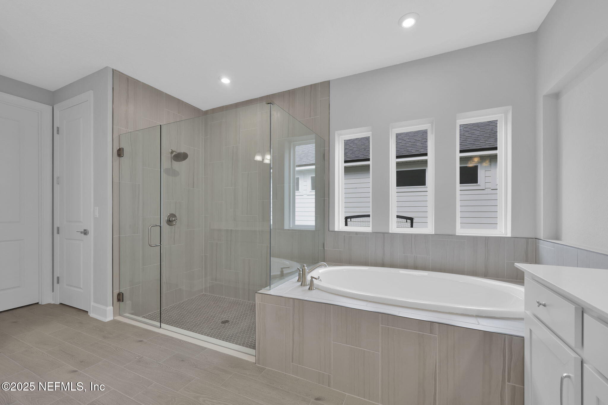 39 Greylock Lane St. Augustine, FL 32092 - Photo 42 of 54 a bathroom with a bathtub and a shower