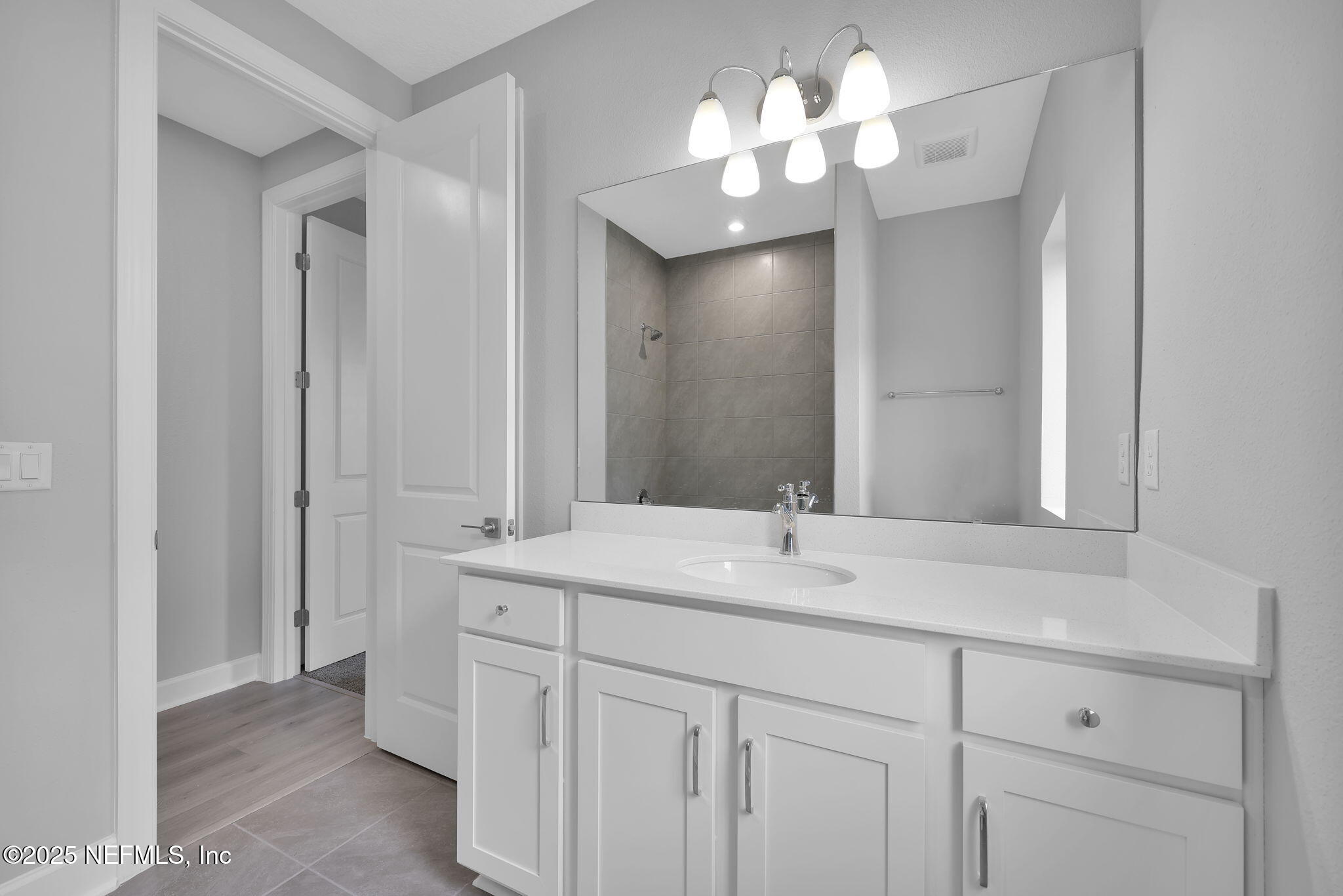 39 Greylock Lane St. Augustine, FL 32092 - Photo 49 of 54 a bathroom with a sink vanity and a mirror