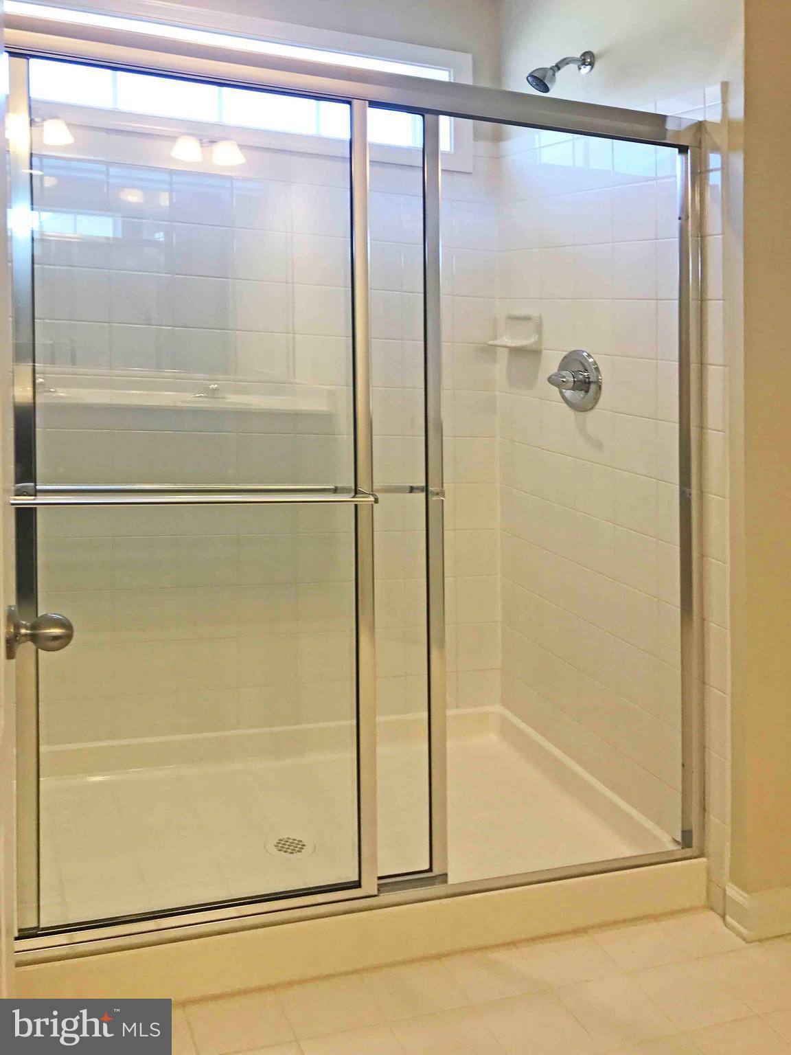55 Blakely Road Kearneysville, WV 25430 - Photo 11 of 15 a bathroom with a glass shower door