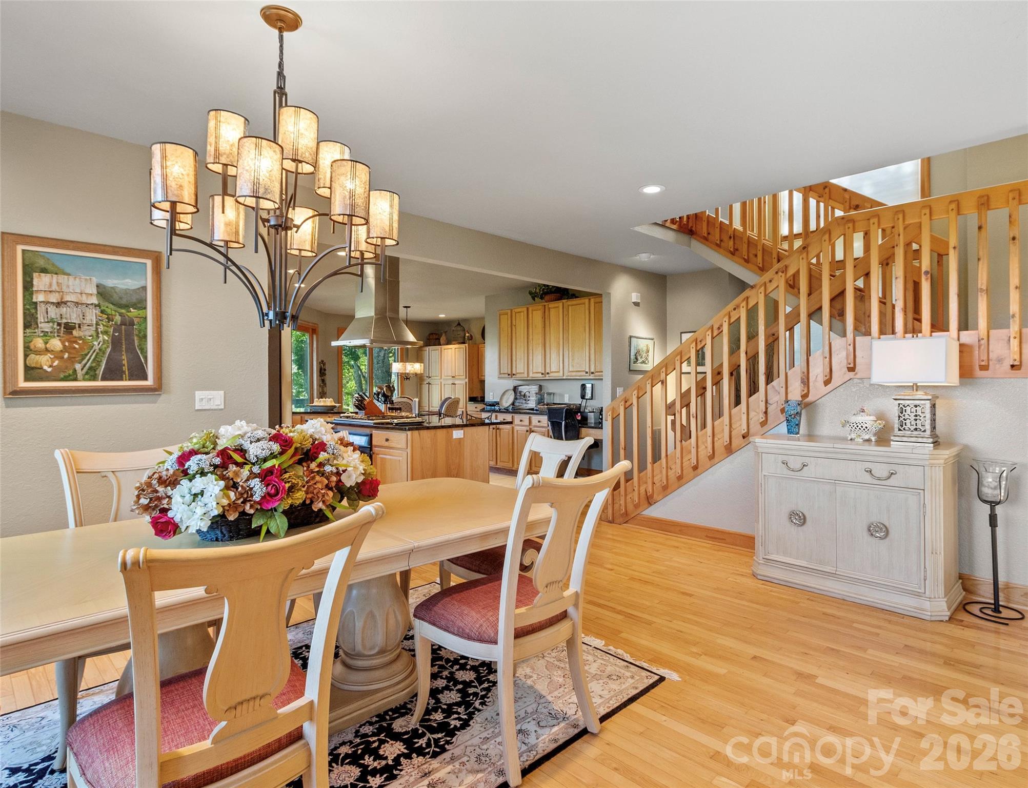 350 Ball Camp Road Burnsville, NC 28714 - Photo 13 of 44 a view of a dining room with furniture and chandelier