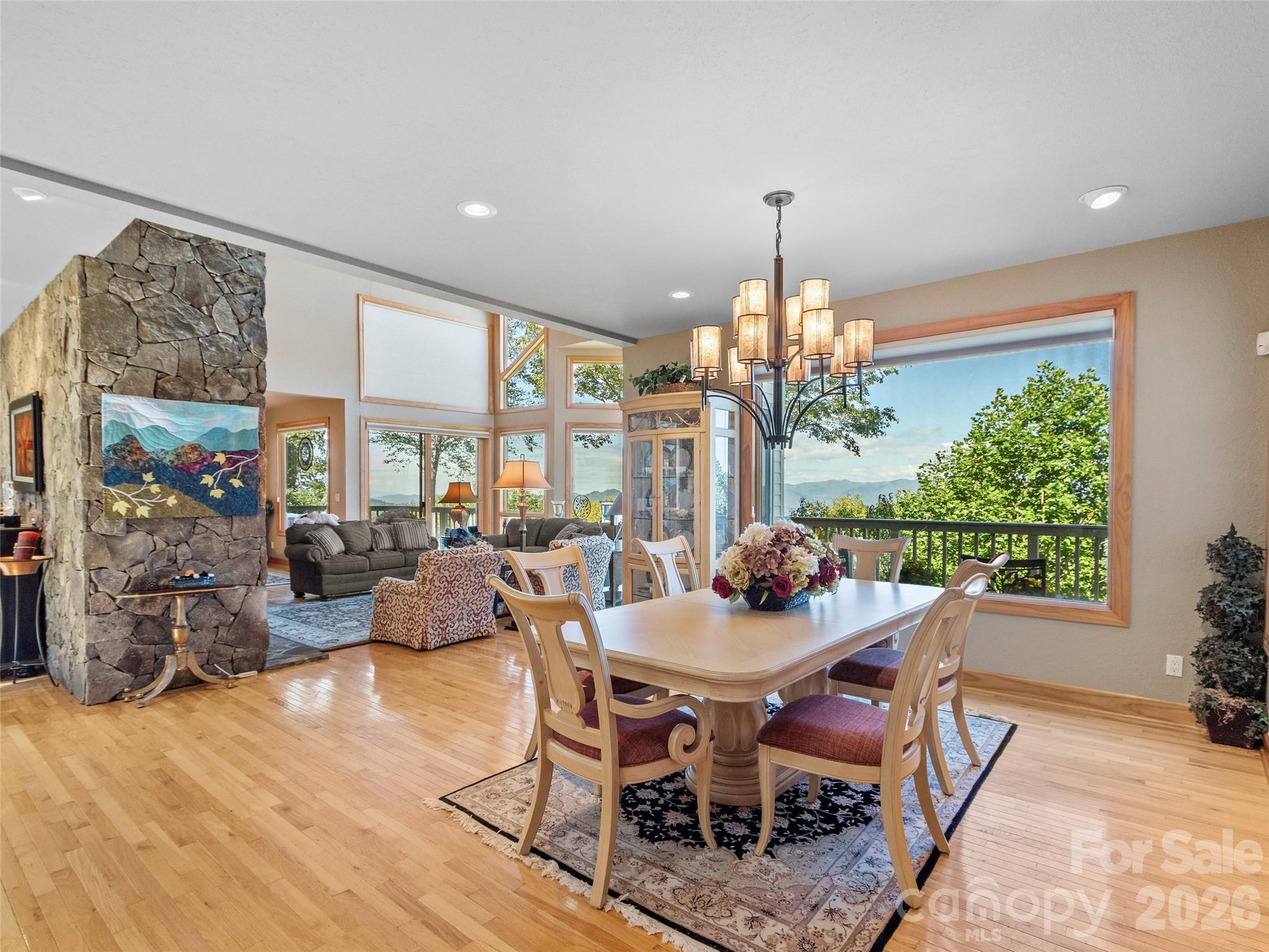 350 Ball Camp Road Burnsville, NC 28714 - Photo 14 of 44 a view of a dining room with furniture window and outside view