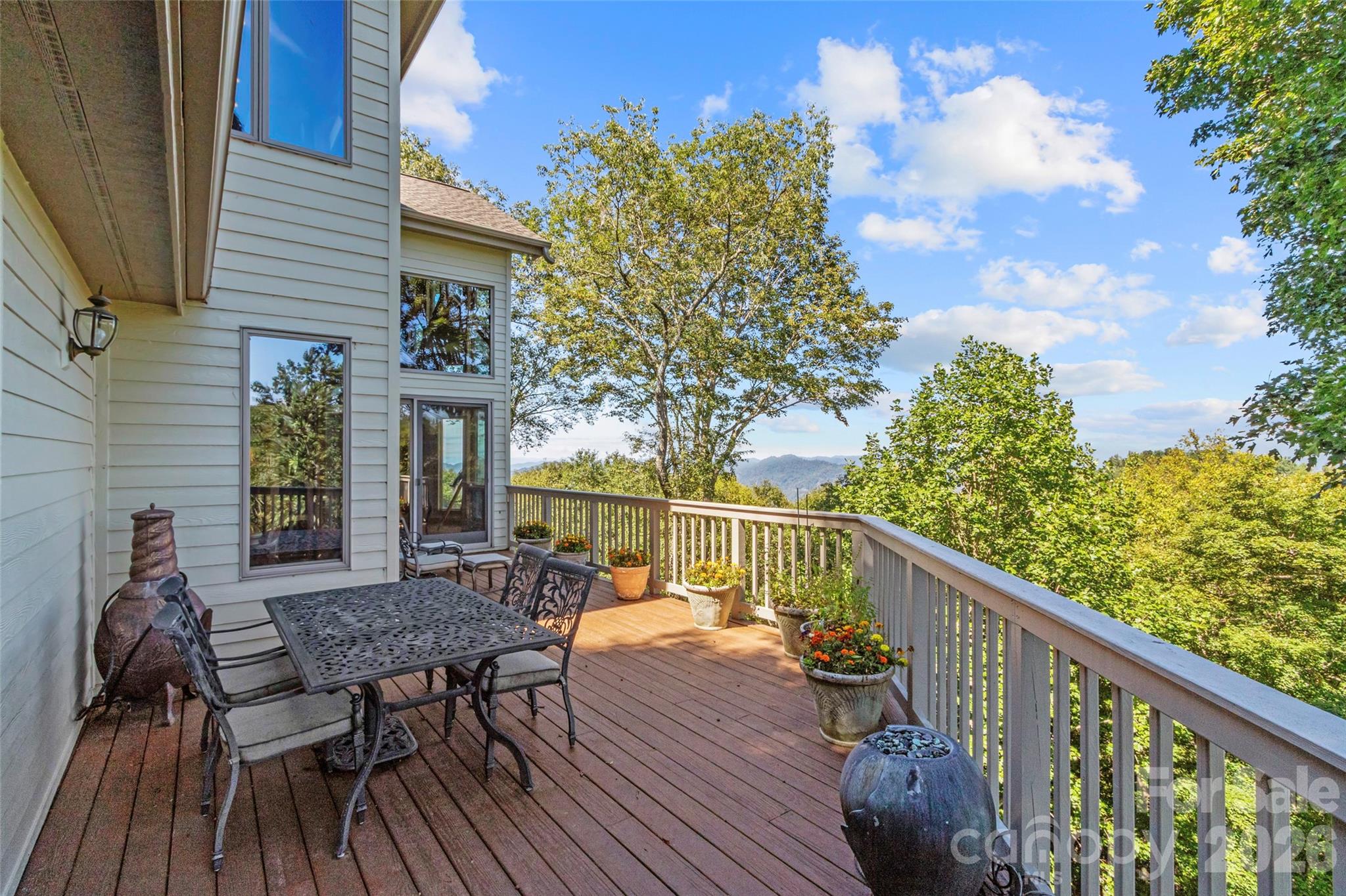 350 Ball Camp Road Burnsville, NC 28714 - Photo 15 of 44 a view of balcony with furniture and wooden deck