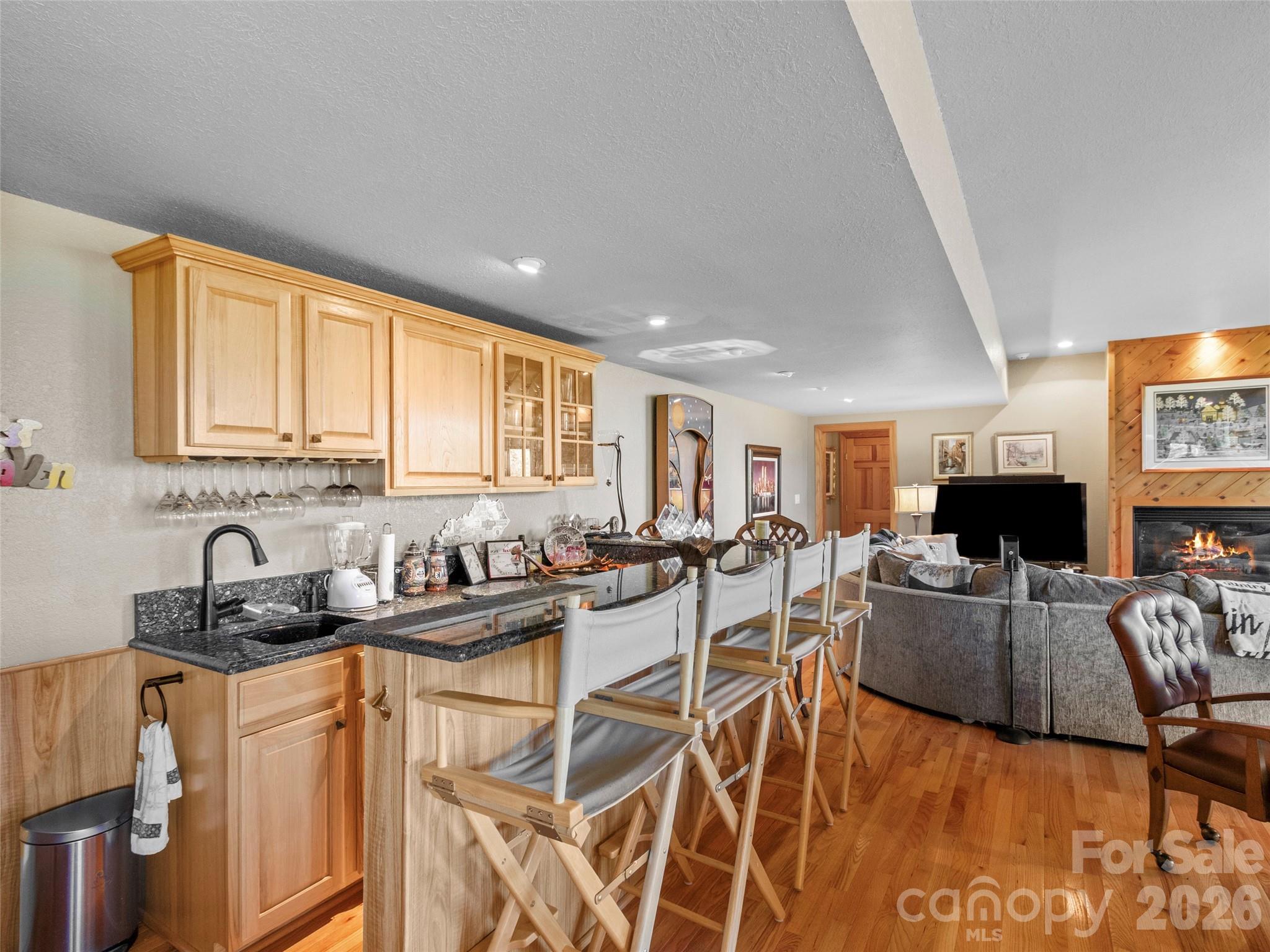 350 Ball Camp Road Burnsville, NC 28714 - Photo 23 of 44 a kitchen with stainless steel appliances granite countertop sink stove and cabinets
