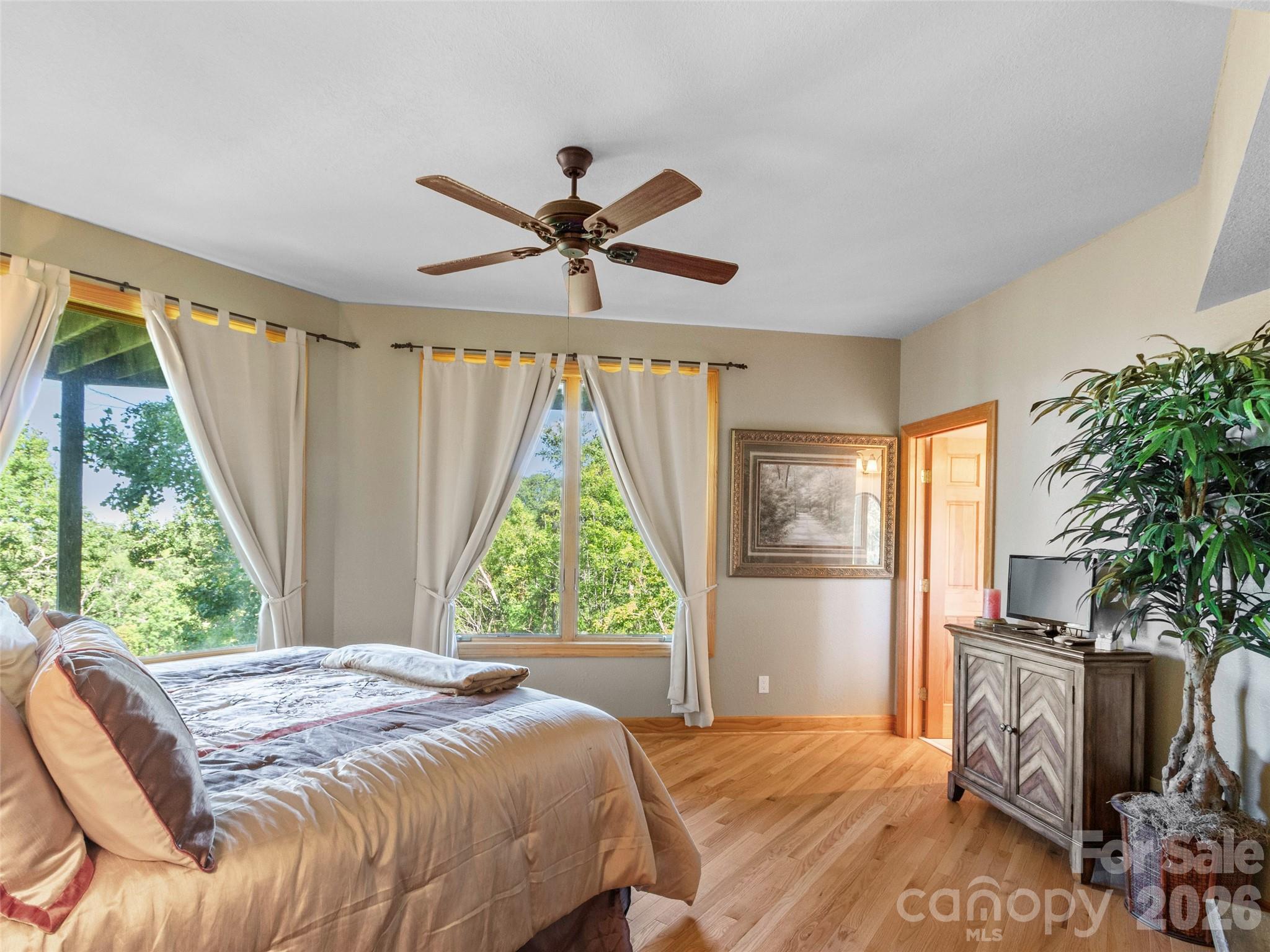 350 Ball Camp Road Burnsville, NC 28714 - Photo 27 of 44 a bedroom with a bed and a large window