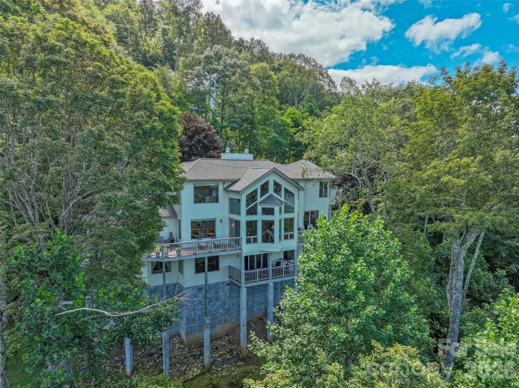 350 Ball Camp Road Burnsville, NC 28714 - Photo 40 of 44 a view of a house with balcony
