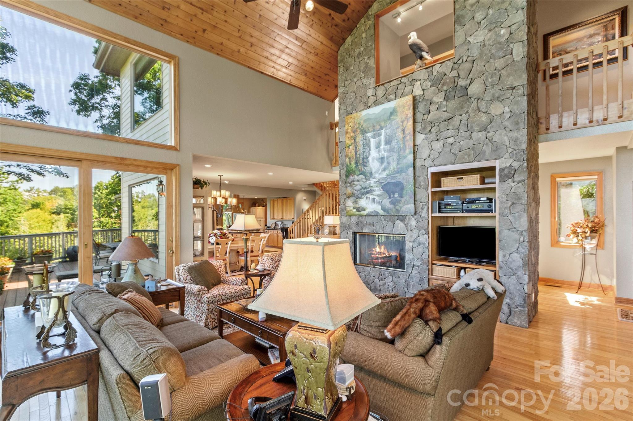 350 Ball Camp Road Burnsville, NC 28714 - Photo 6 of 44 a living room with fireplace furniture and a flat screen tv