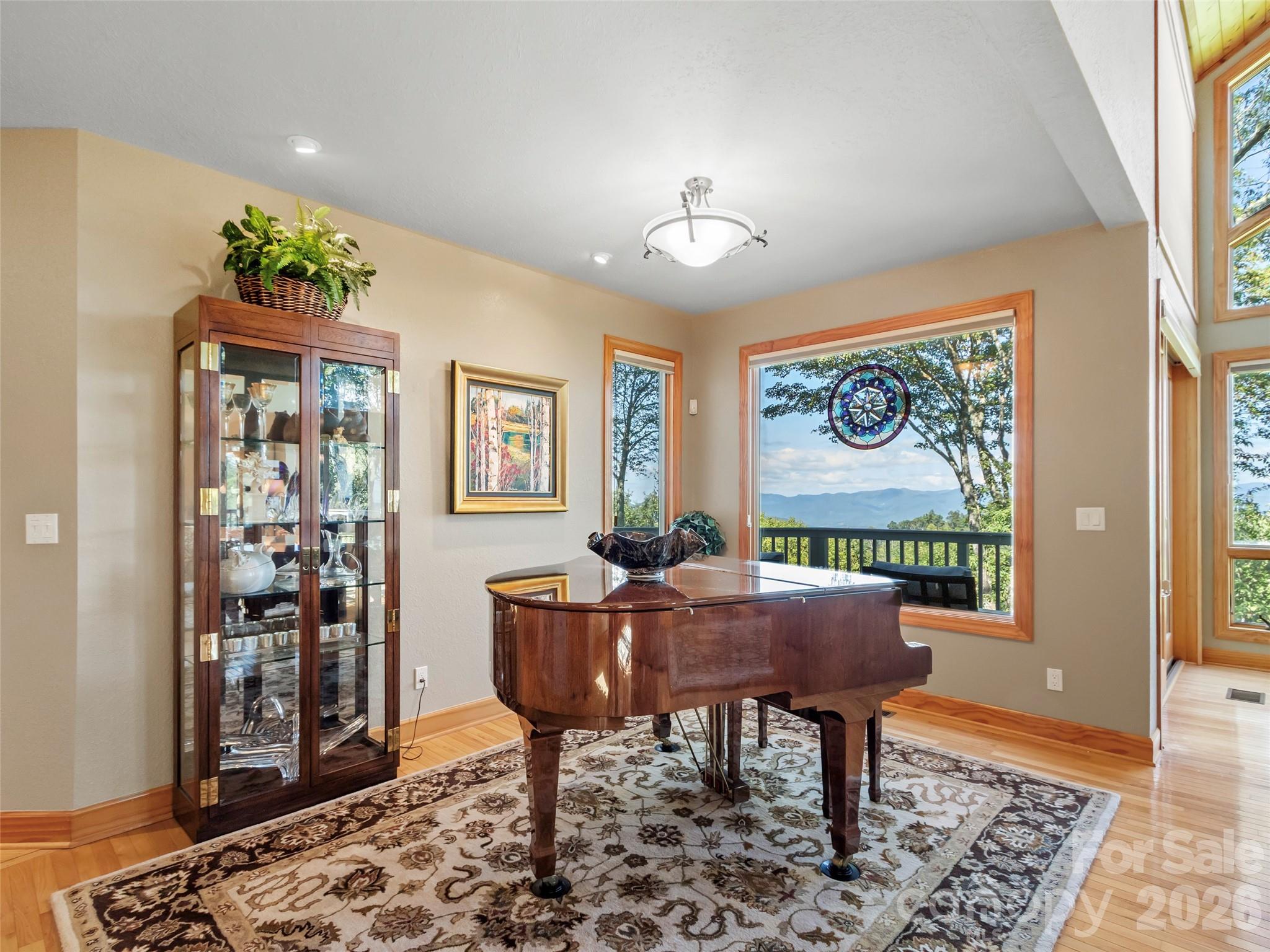 350 Ball Camp Road Burnsville, NC 28714 - Photo 8 of 44 a view of a dining room with furniture window and wooden floor