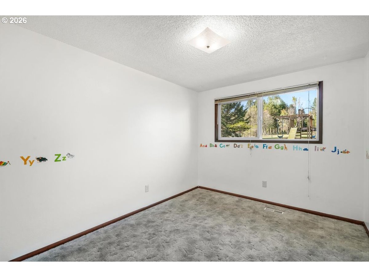 2035 Primrose Loop Philomath, OR 97370 - Photo 43 of 48 an empty room with a window