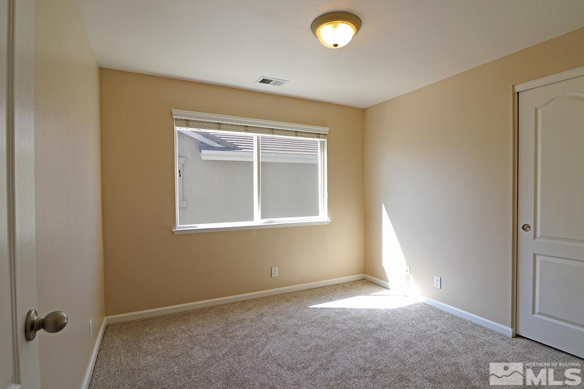 10047 Silver Star Drive Reno, NV 89521 - Photo 15 of 26 an empty room with windows