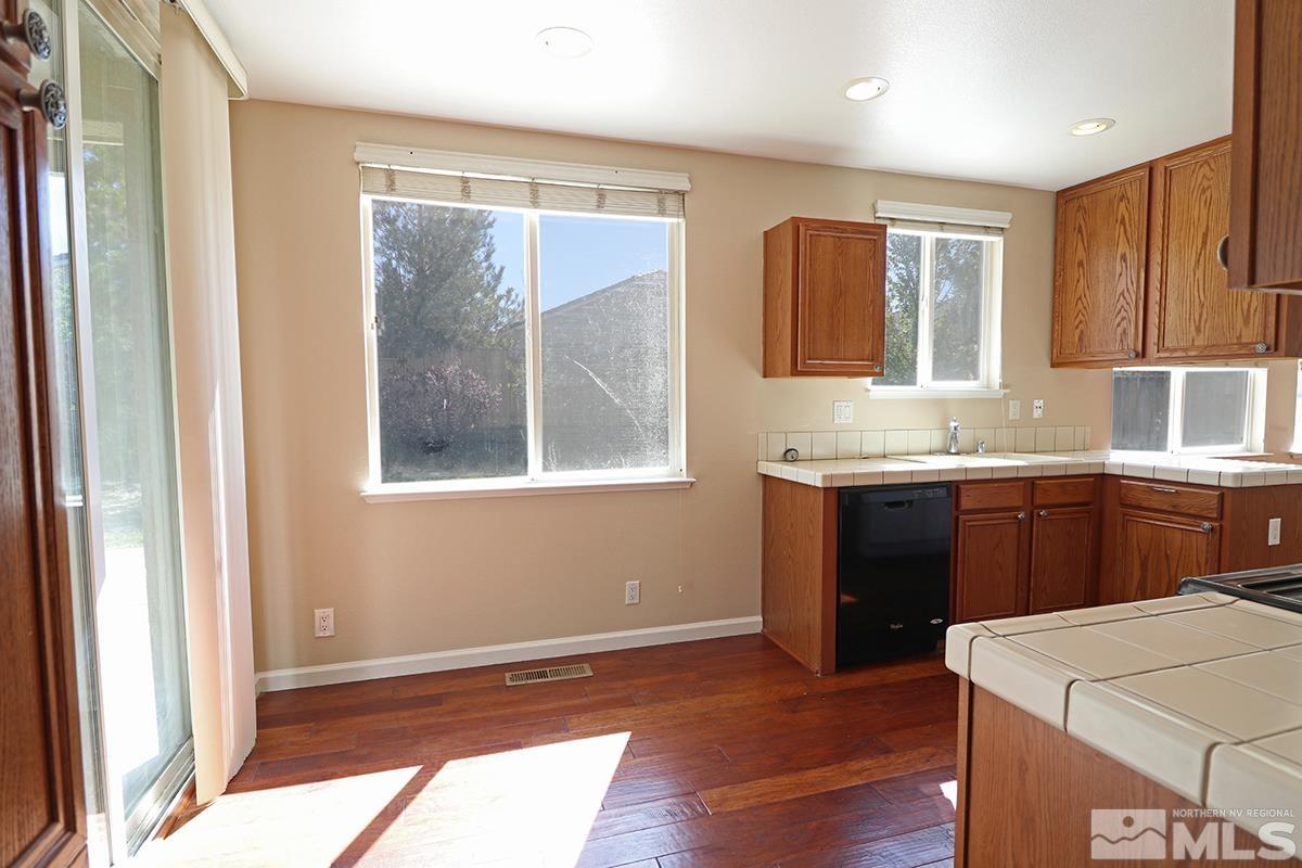 10047 Silver Star Drive Reno, NV 89521 - Photo 20 of 26 a kitchen with a sink and a window