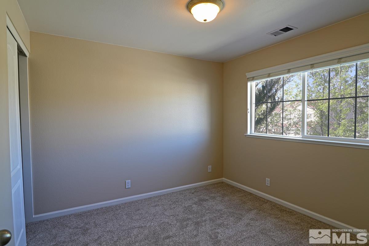 10047 Silver Star Drive Reno, NV 89521 - Photo 23 of 26 an empty room with a window
