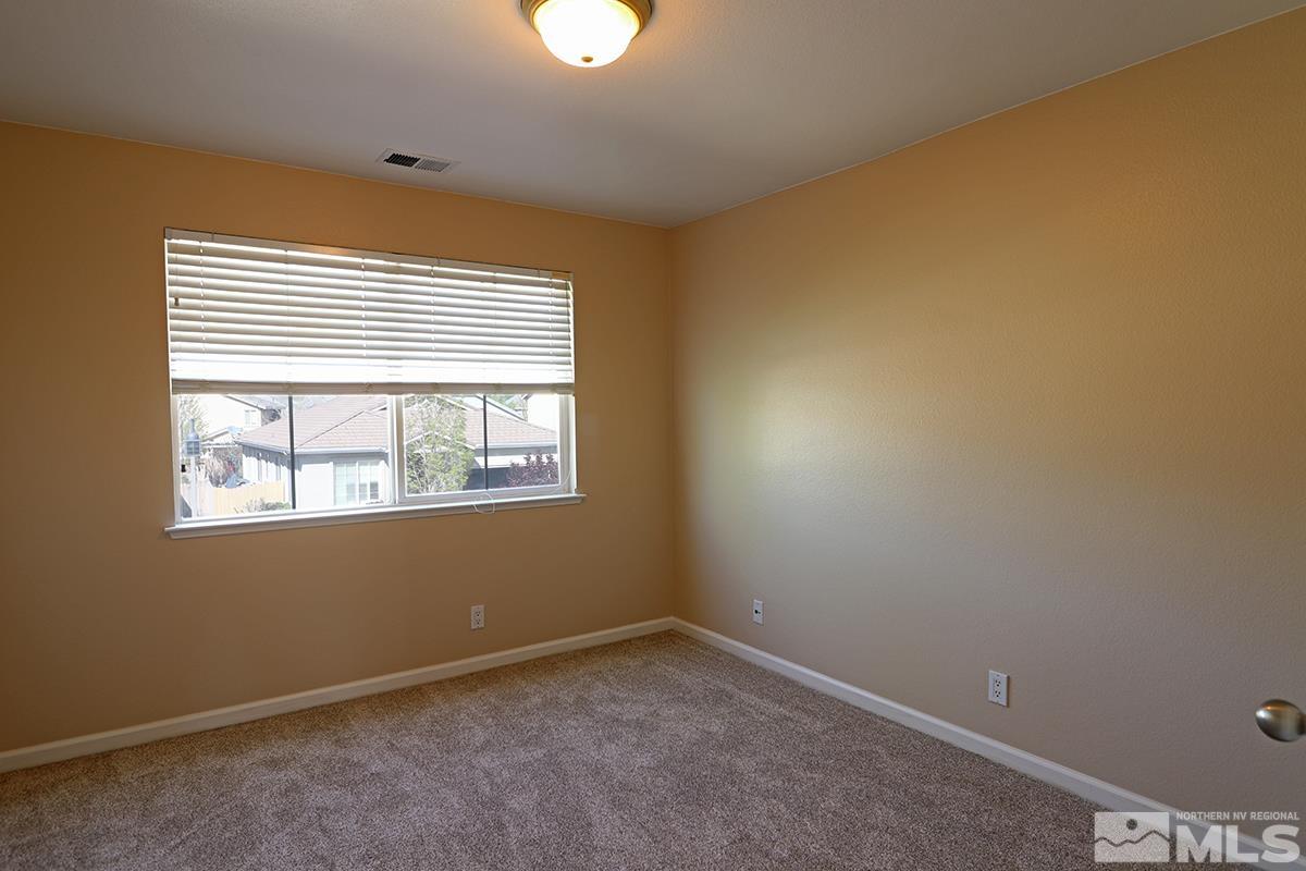 10047 Silver Star Drive Reno, NV 89521 - Photo 24 of 26 a view of an empty room with a window