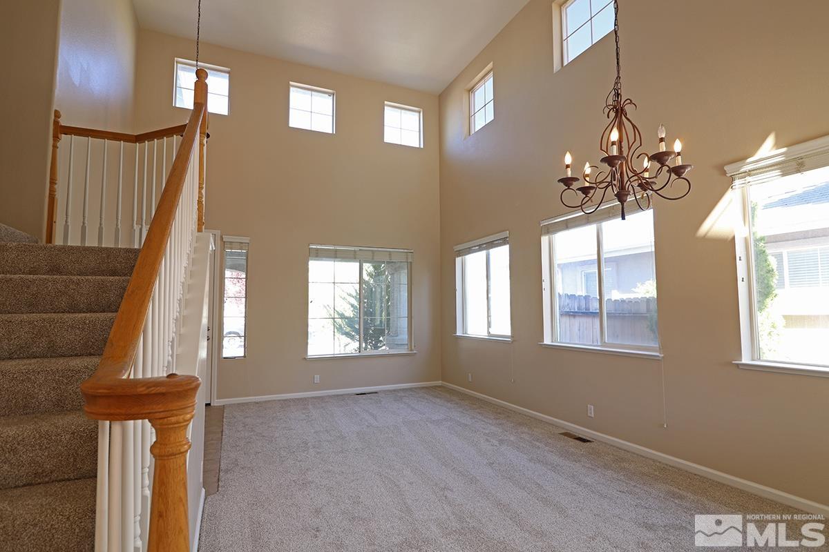 10047 Silver Star Drive Reno, NV 89521 - Photo 4 of 26 a view of an entryway with wooden floor