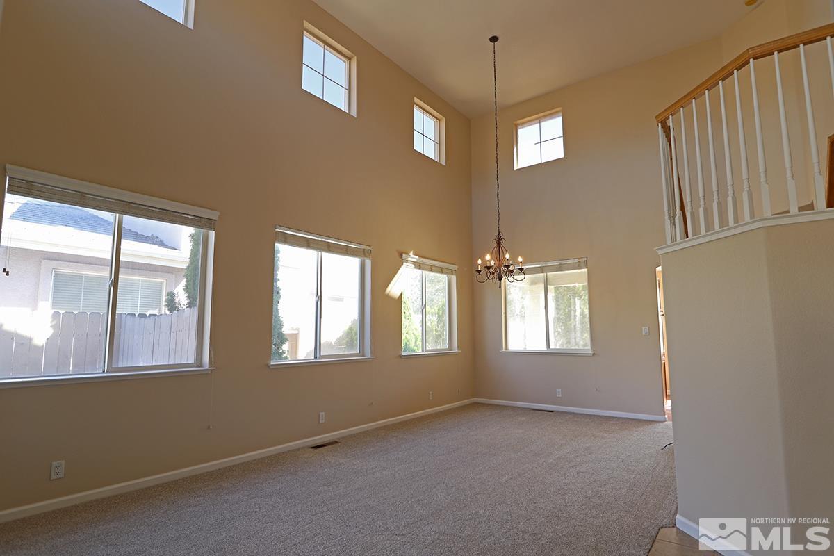 10047 Silver Star Drive Reno, NV 89521 - Photo 5 of 26 a view of an empty room with a window