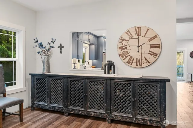 a large bedroom with a bed and a flat screen tv