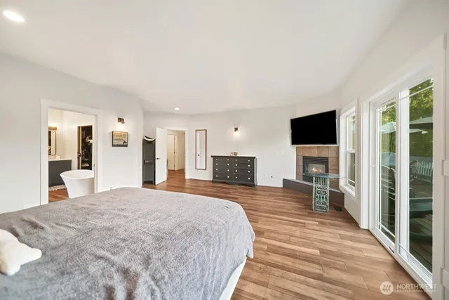a bathroom with a bathtub and shower