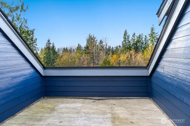 a bedroom with a bed and a mirror