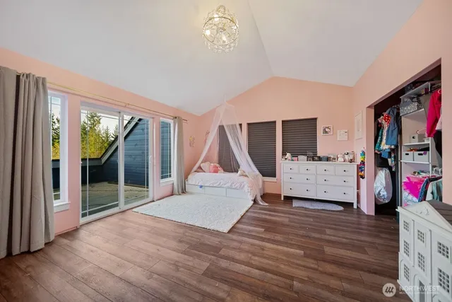 a room with furniture a rug and a window