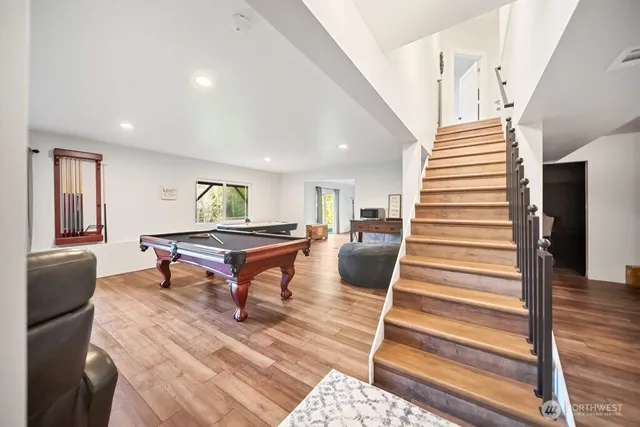 a living room with furniture a table and large window