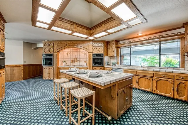 a large bathroom with a double vanity sink and a mirror