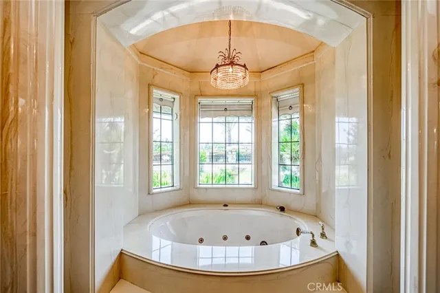 a living room with furniture and a ceiling fan