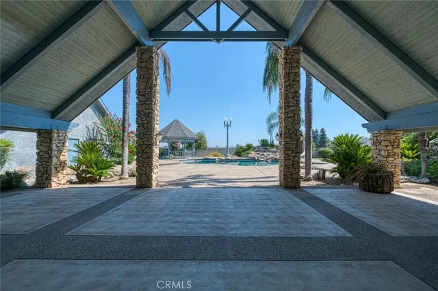 a front view of a building with outdoor seating