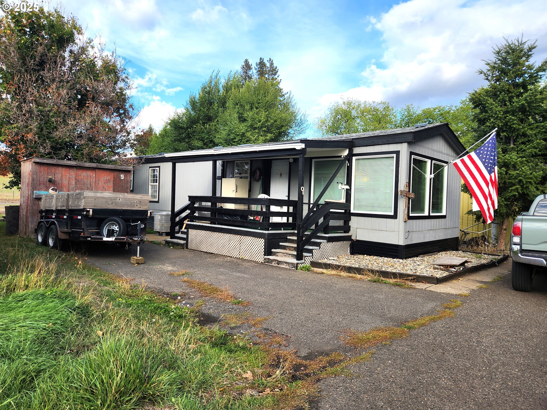 a view of house with outdoor space and porch