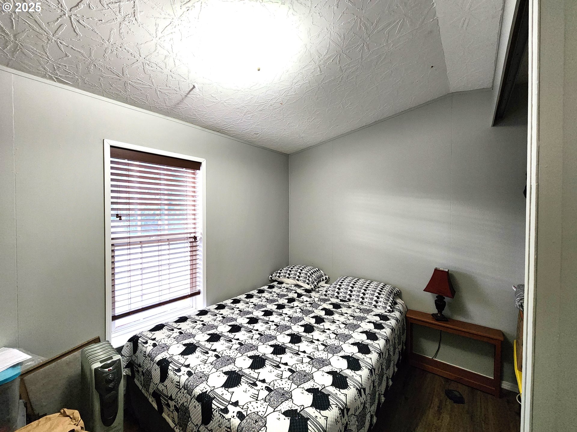 1601 Carolyn Terrace, Unit 9 Elgin, OR 97827 - Photo 6 of 7 a bedroom with a bed and a window