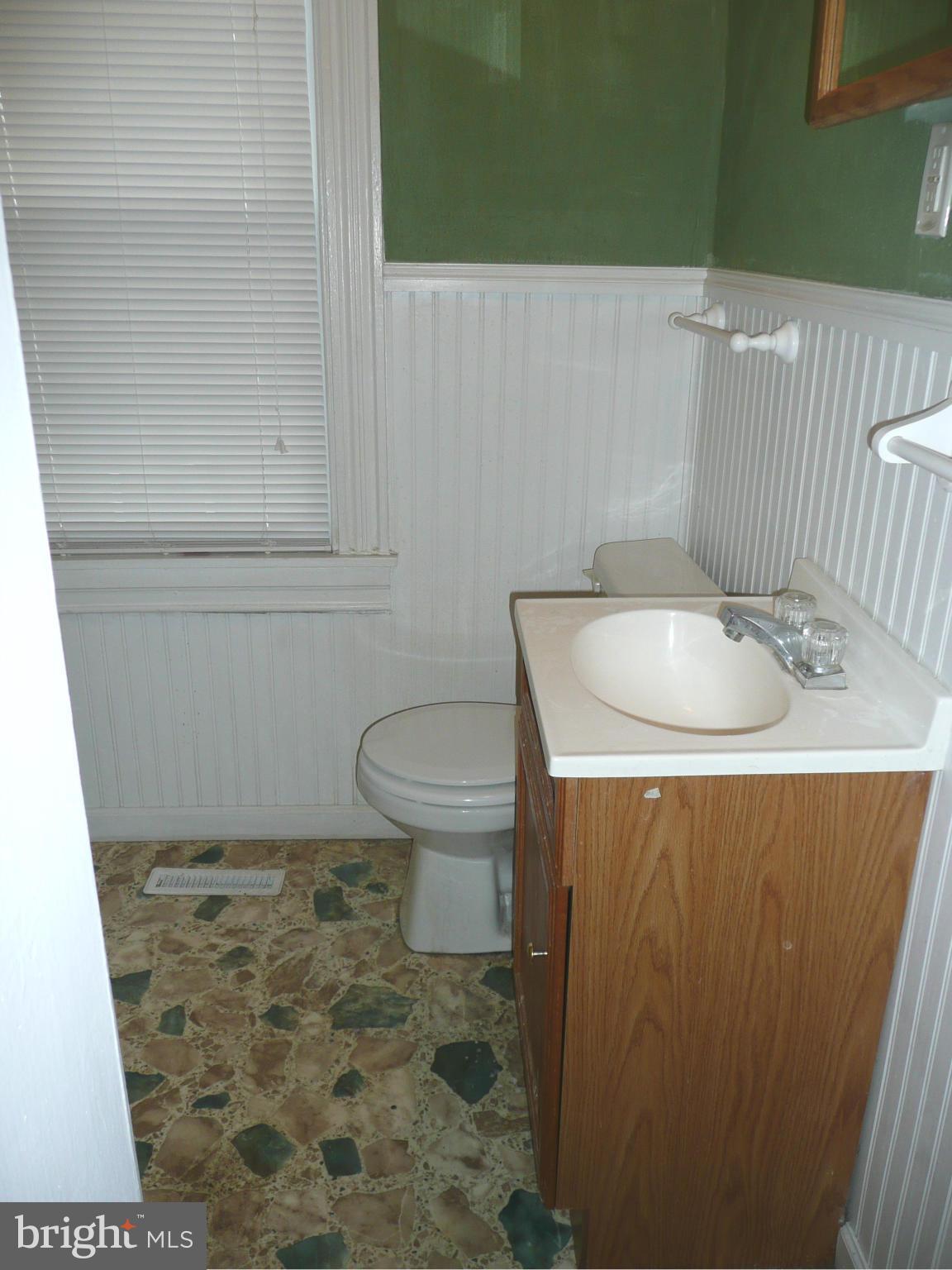 501 South Mildred Street Ranson, WV 25438 - Photo 19 of 29 a bathroom with a sink toilet and a mirror