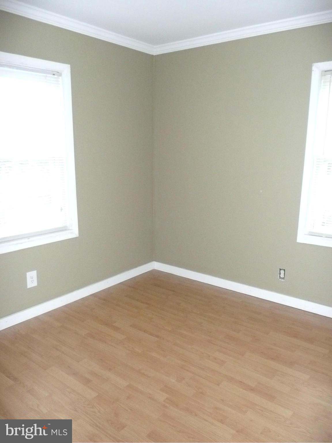 501 South Mildred Street Ranson, WV 25438 - Photo 23 of 29 a view of an empty room with wooden floor and a window