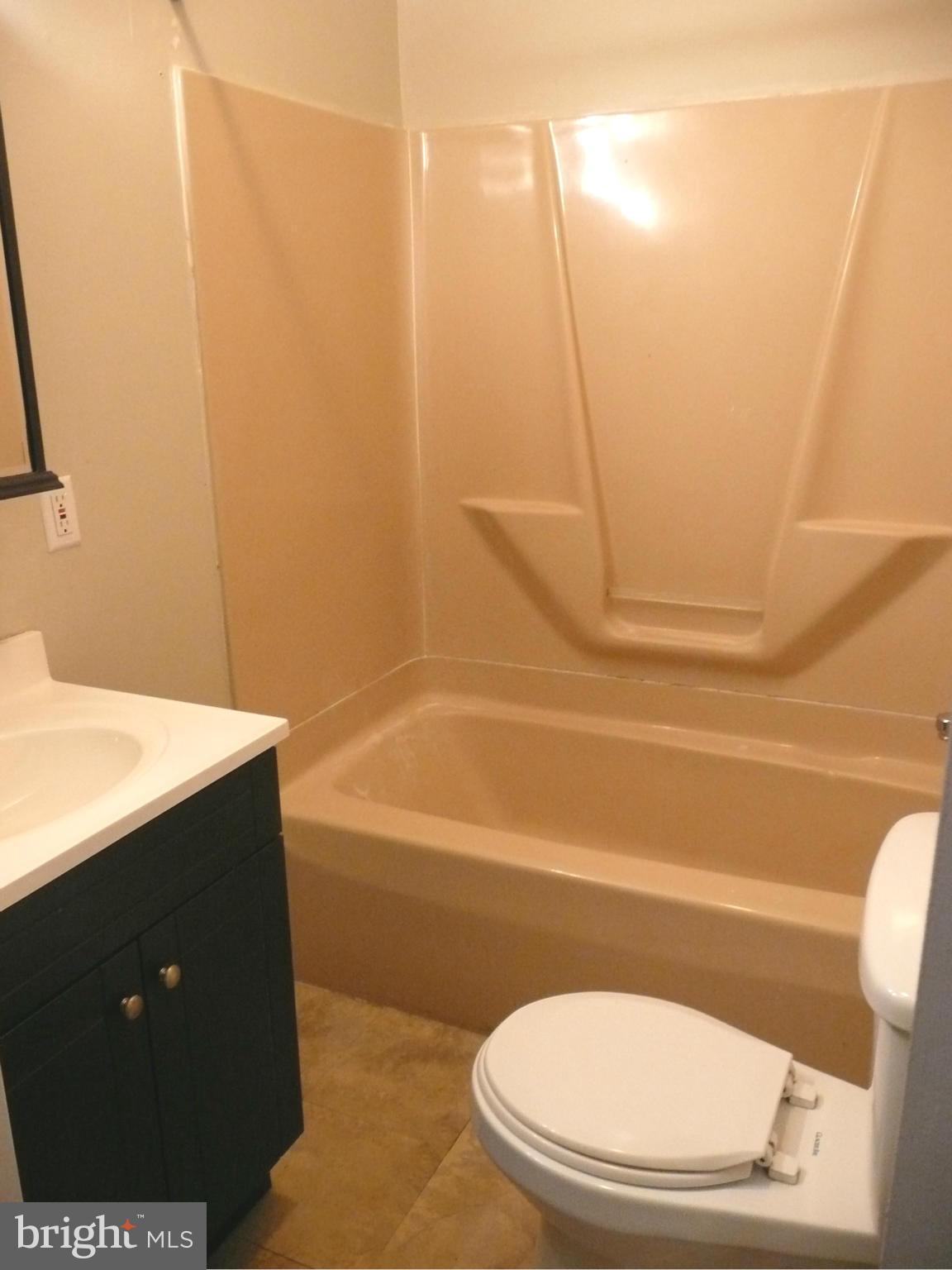 501 South Mildred Street Ranson, WV 25438 - Photo 5 of 29 a bathroom with a sink and a mirror