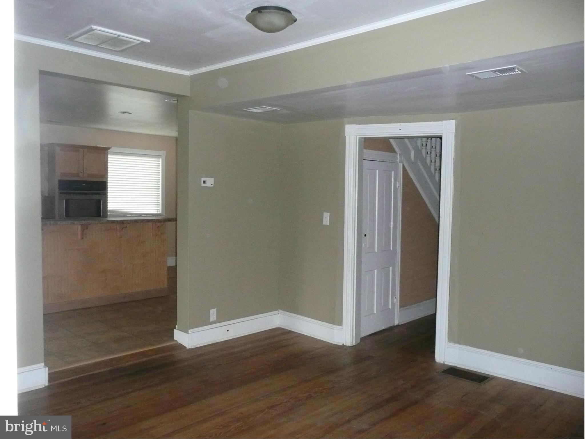 501 South Mildred Street Ranson, WV 25438 - Photo 6 of 29 an empty room with wooden floor and closet