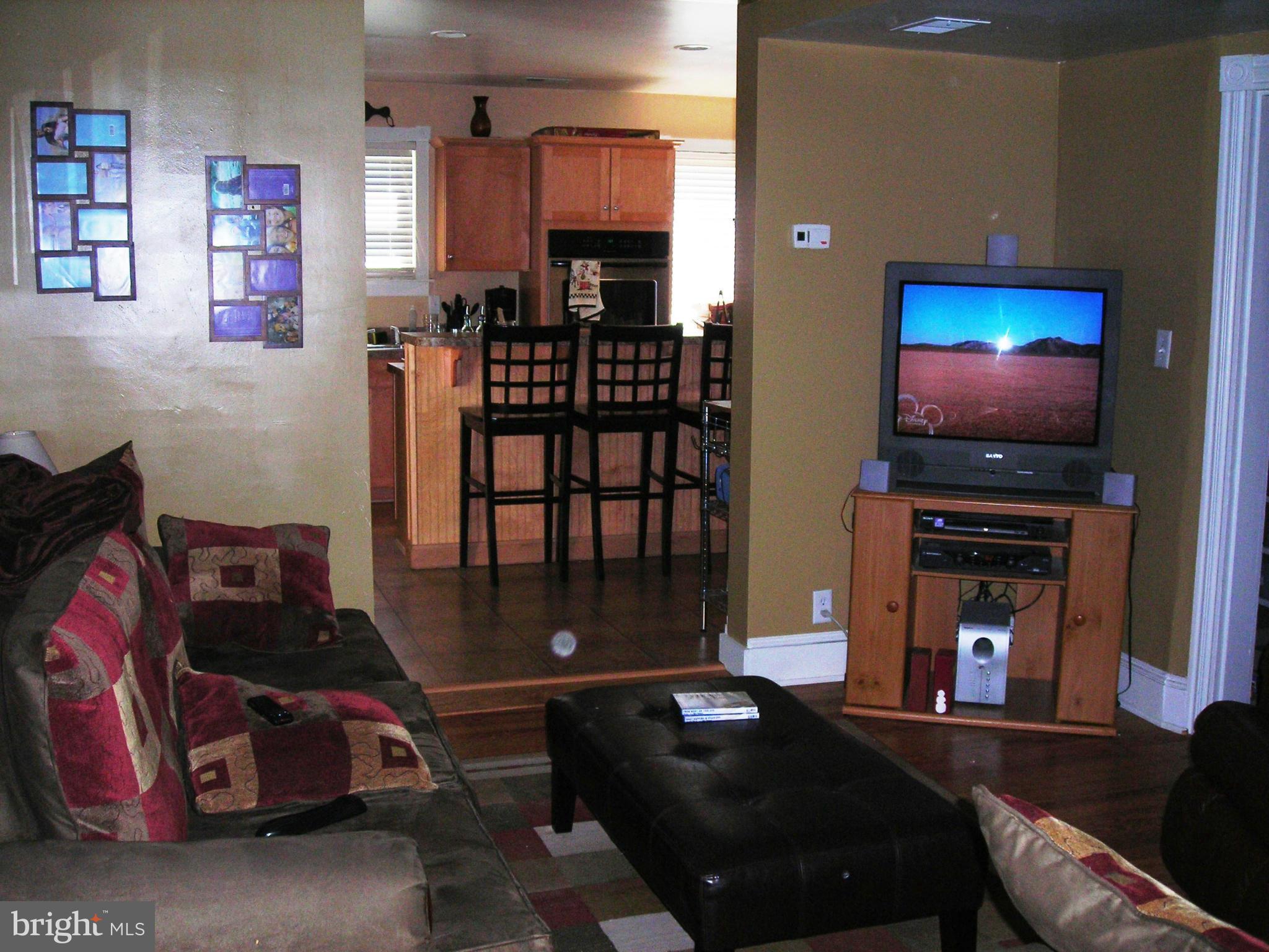 501 South Mildred Street Ranson, WV 25438 - Photo 8 of 29 a living room with furniture a flat screen tv and a fireplace