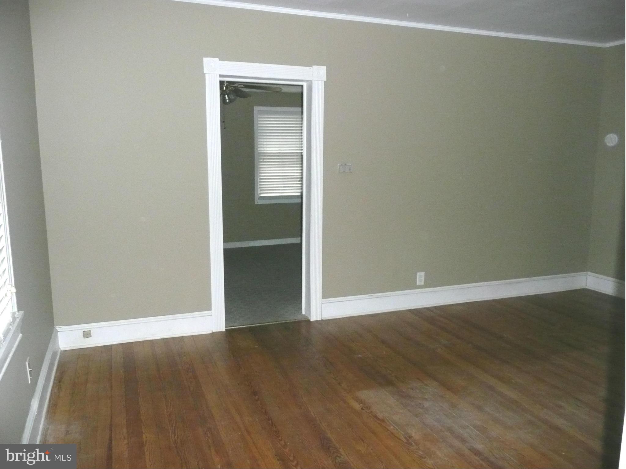 501 South Mildred Street Ranson, WV 25438 - Photo 10 of 29 an empty room with wooden floor & closet