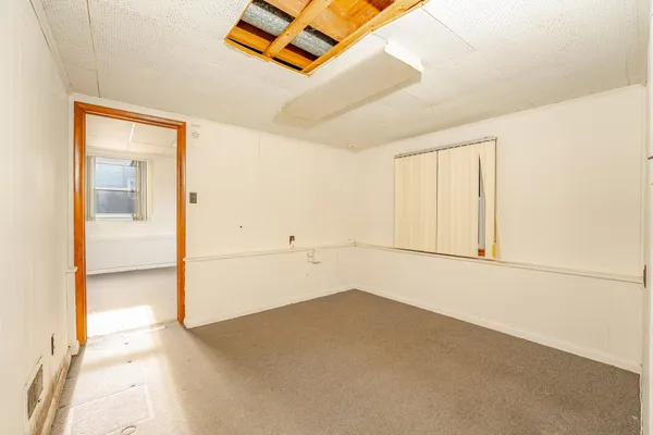 a view of an empty room with a window