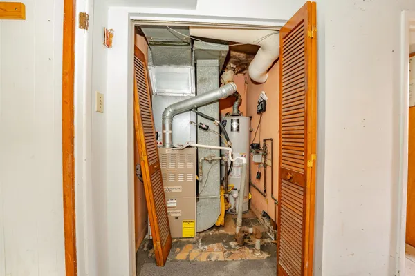 a view of a kitchen that has a sink and a window in it