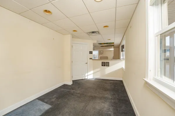 a view of empty room with windows