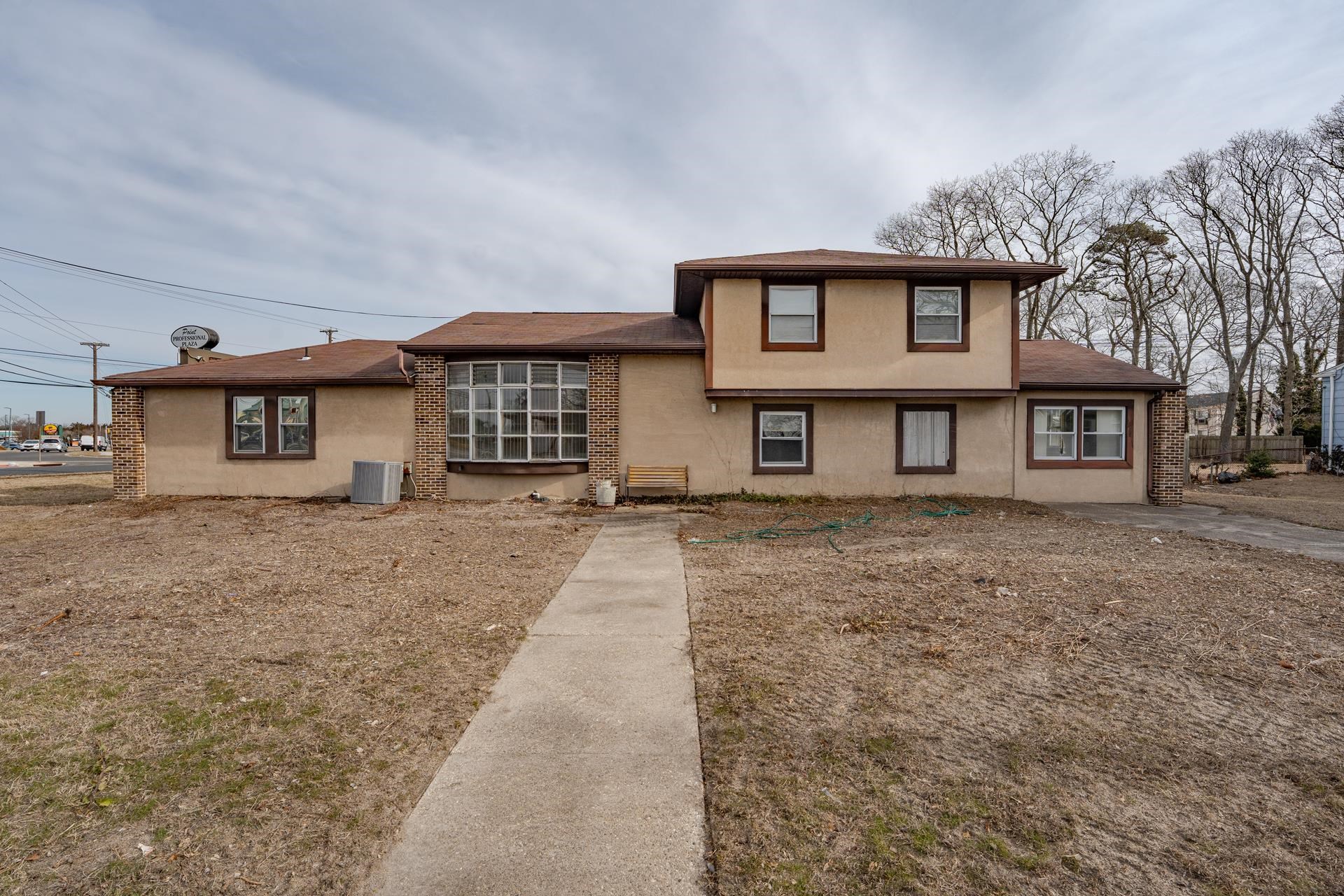 98 New Somers Point, NJ 08244 - Photo 45 of 49 front view of a house with a dry yard