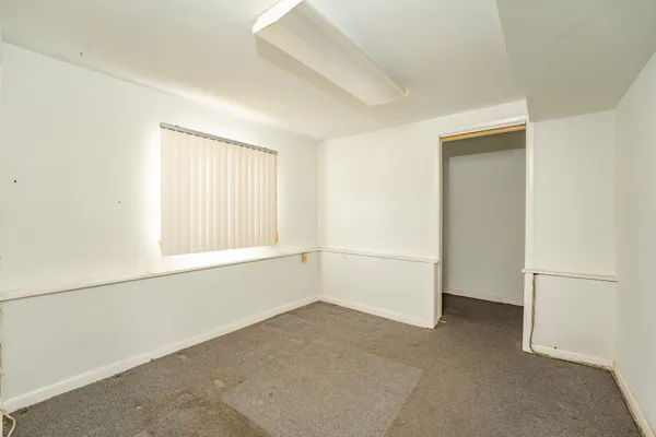 a view of a room that has a window in it