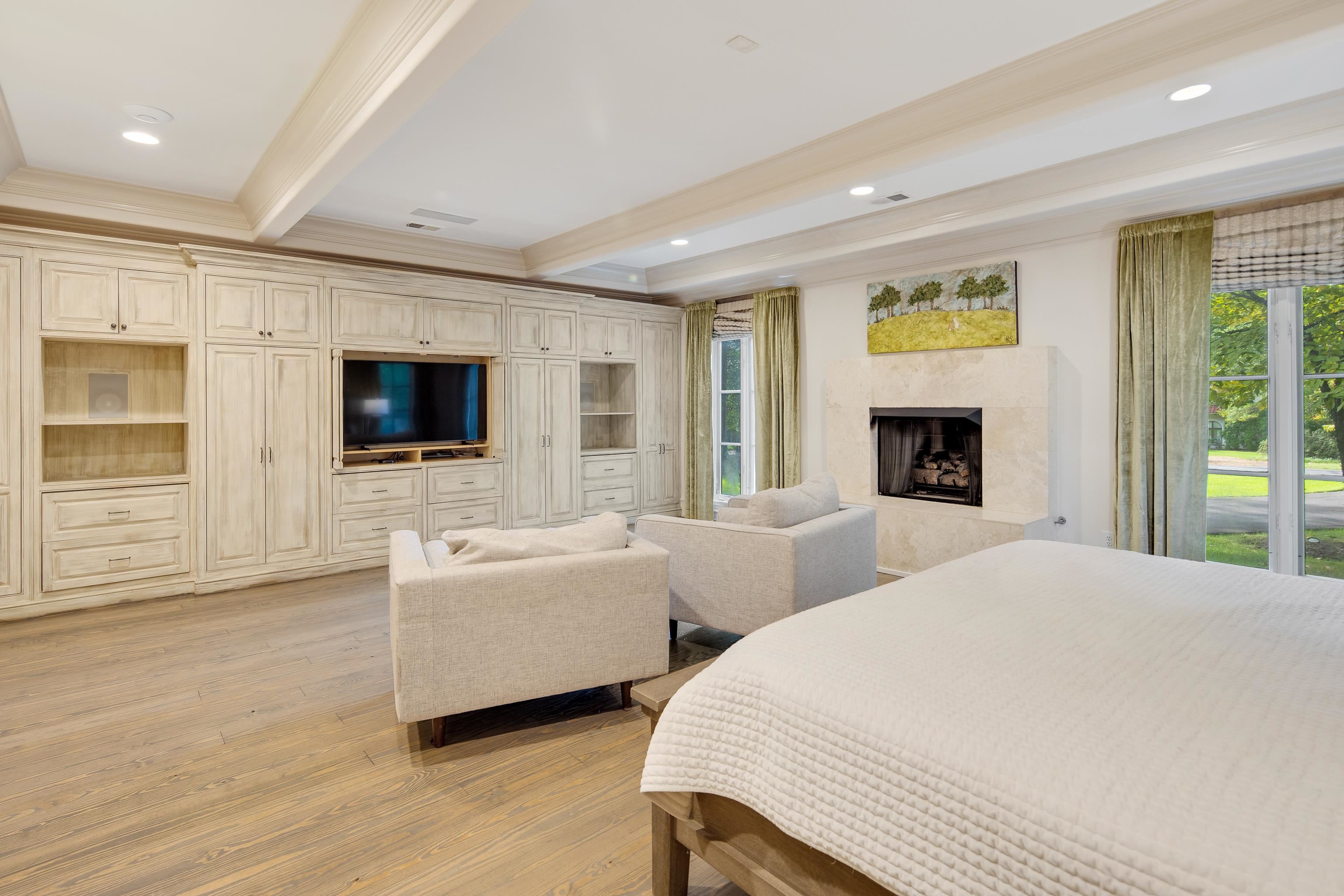 4392 Tuckahoe Road Memphis, TN 38117 - Photo 25 of 40 Bedroom with beamed ceiling, a premium fireplace, access to outside, ornamental molding, and light wood-type flooring