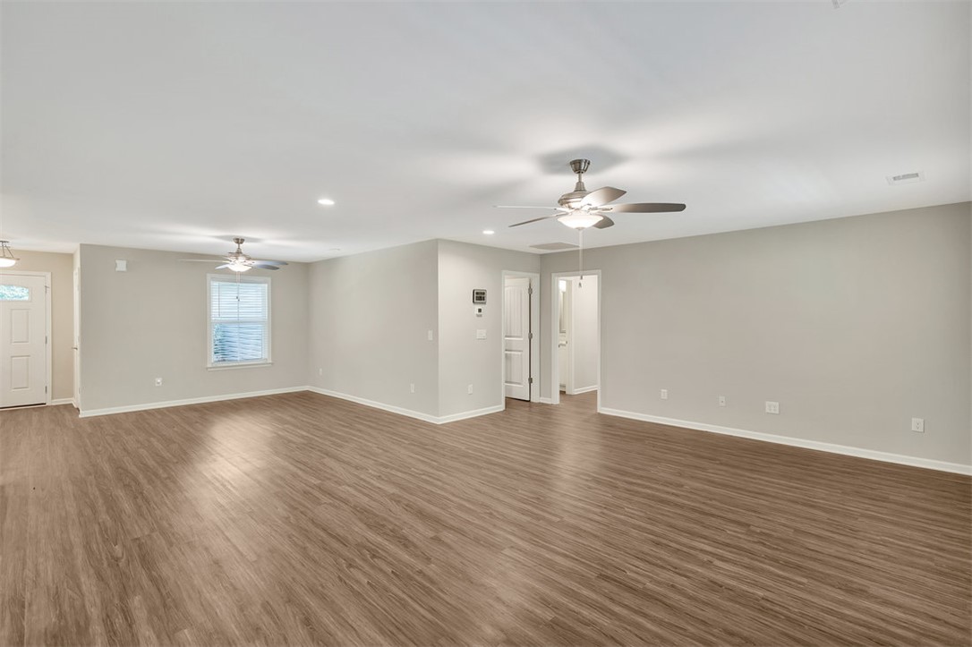 303 Plantation Point Anderson, SC 29625 - Photo 32 of 35 This expansive living space features durable flooring and ample natural light, ideal for comfortable living.