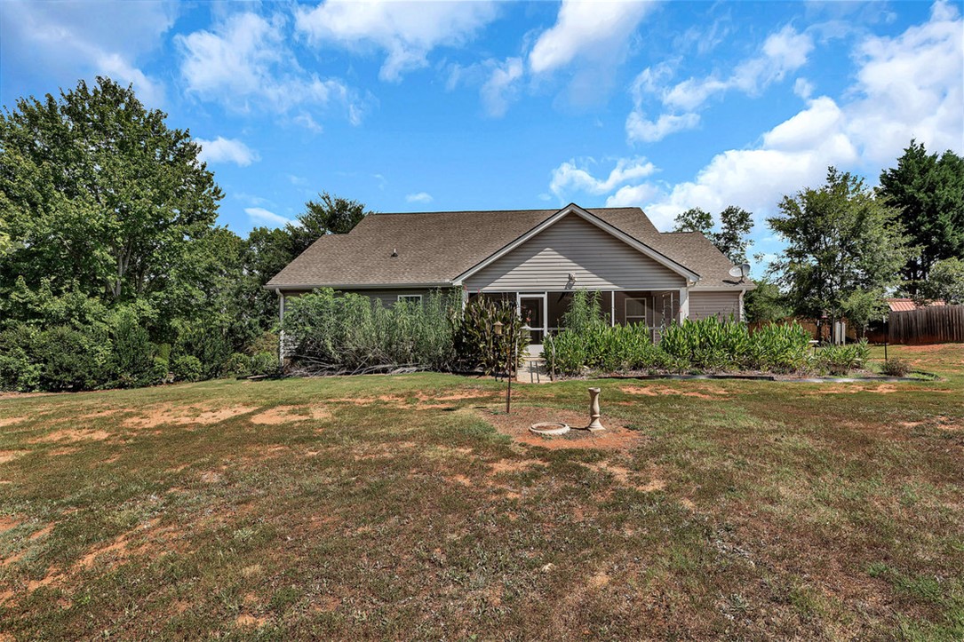 303 Plantation Point Anderson, SC 29625 - Photo 6 of 35 This charming home offers a tranquil retreat with a spacious yard and inviting screened porch.