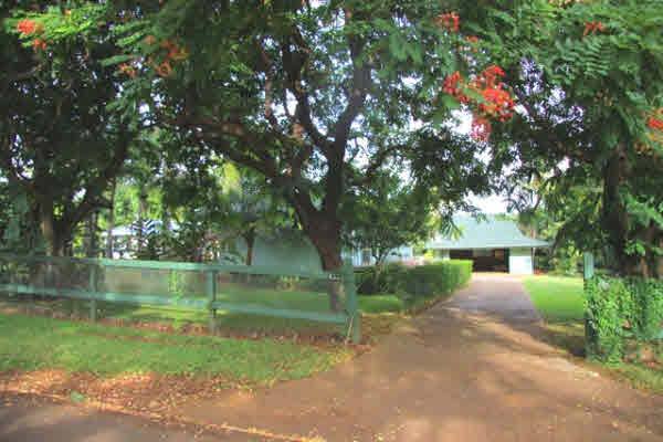 4332 Punee Road Koloa, HI 96756 - Photo 1 of 24 a front view of a house with garden